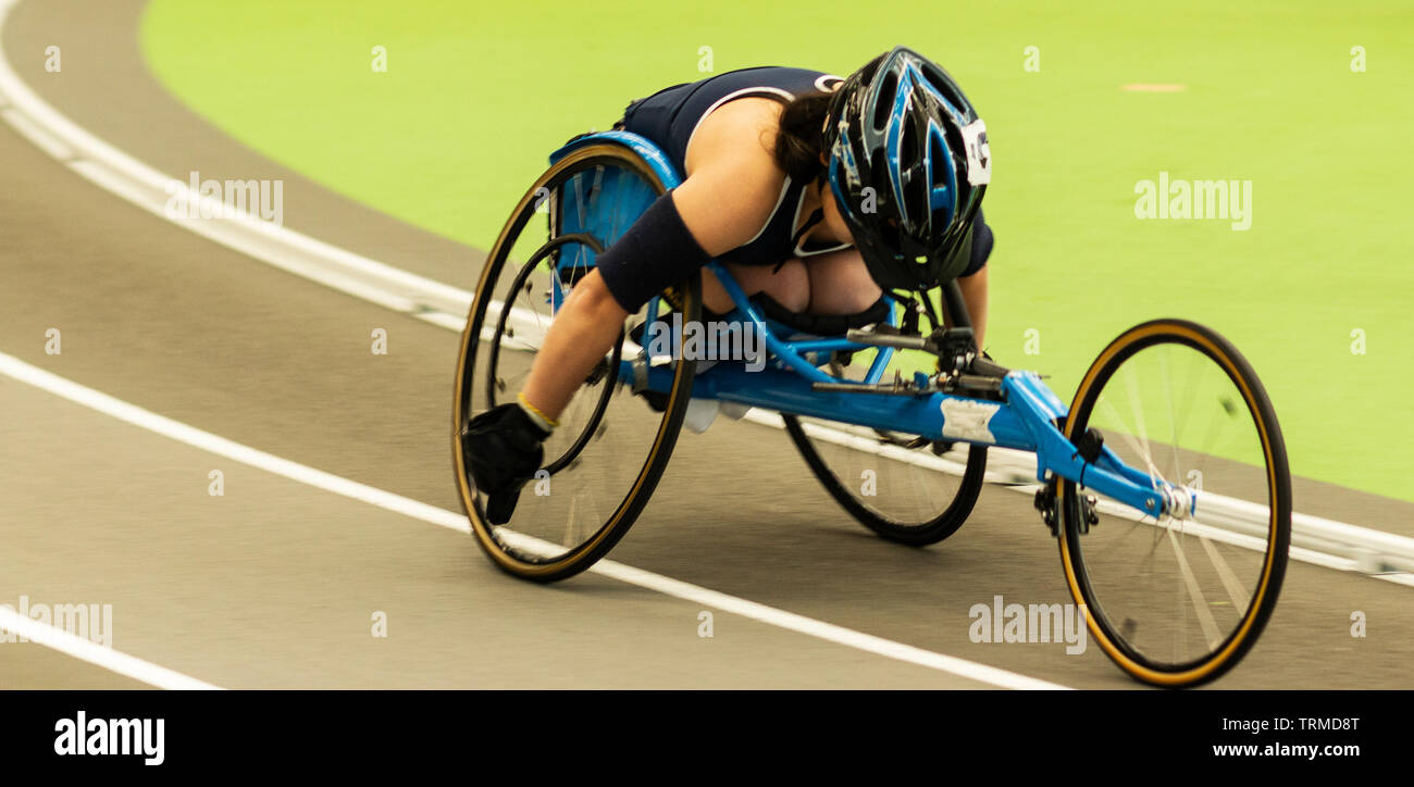 A high school wheelchair athlete competes in the mile at the New York State Track and Field Championships. Stock Photo