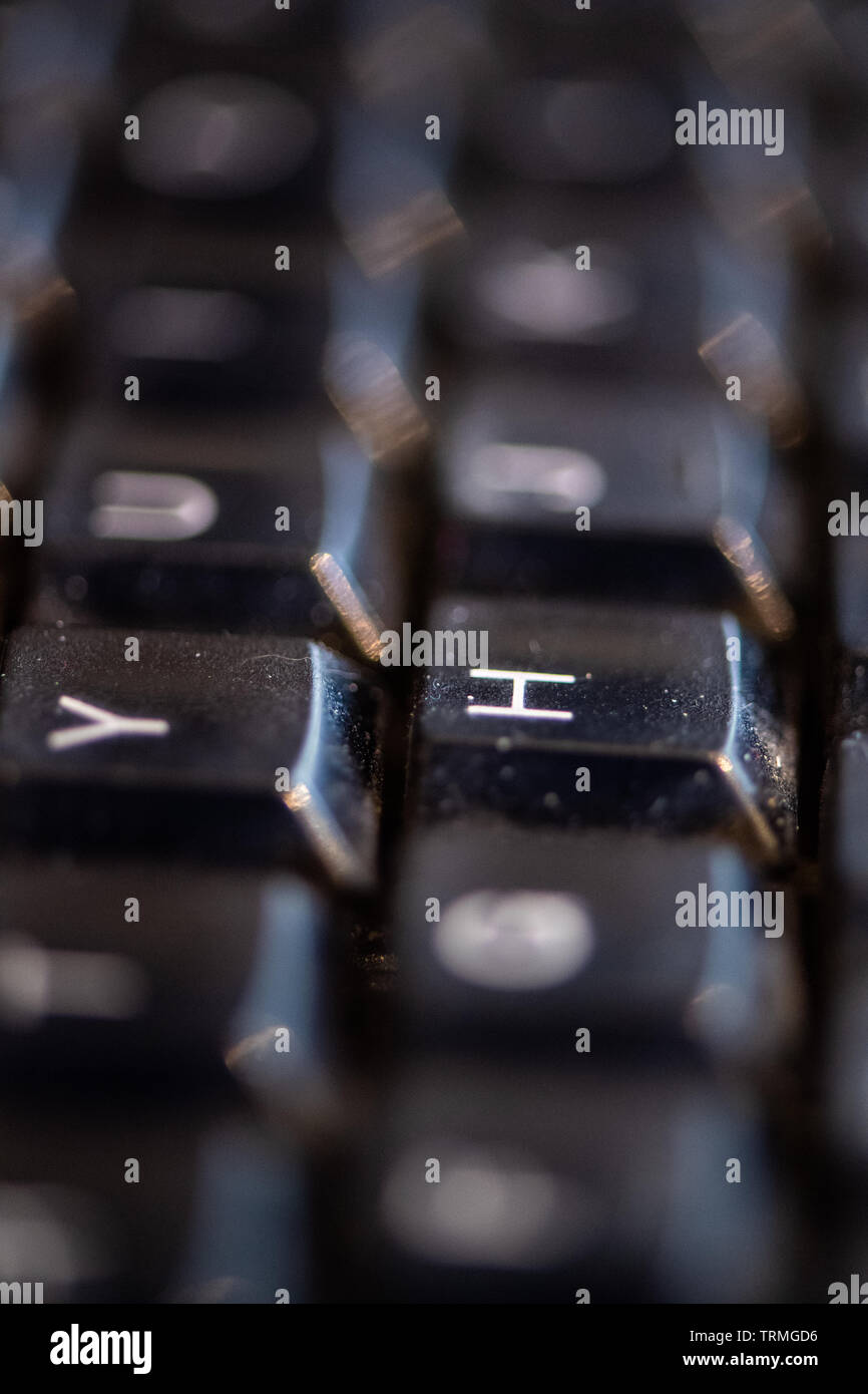 Close up of Dirty computer keyboard, showing dust and general mess. Stock Photo