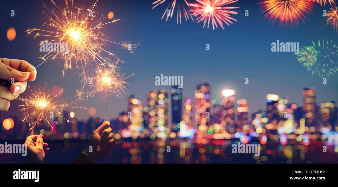 Vintage Abstract Celebration With Bokeh - Blurred City Light At Twilight And Sparklers Stock Photo