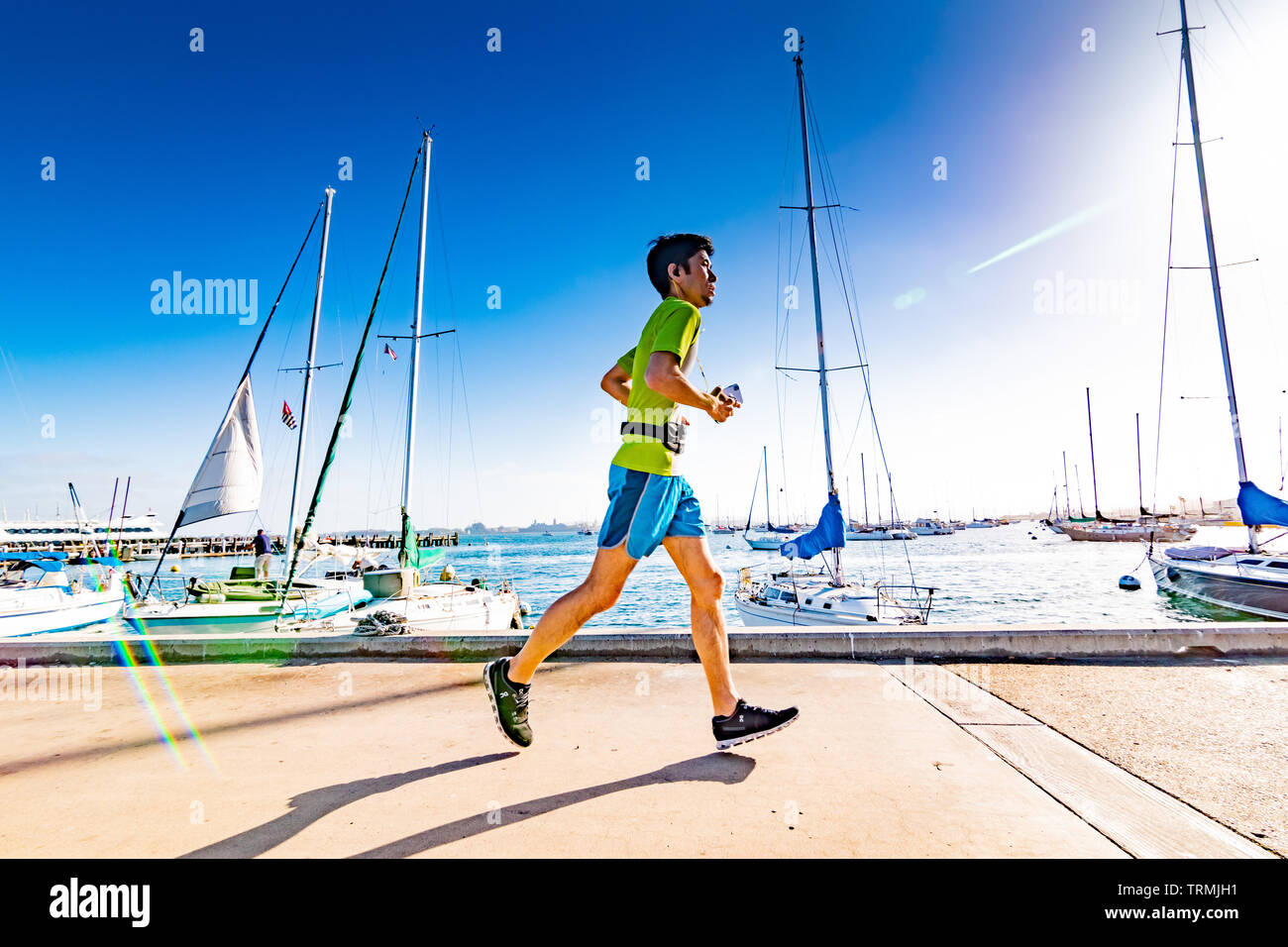 Jogging By the Marina Stock Photo