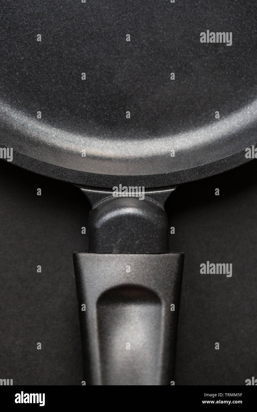 Closeup of non-stick frying pan on black background Stock Photo