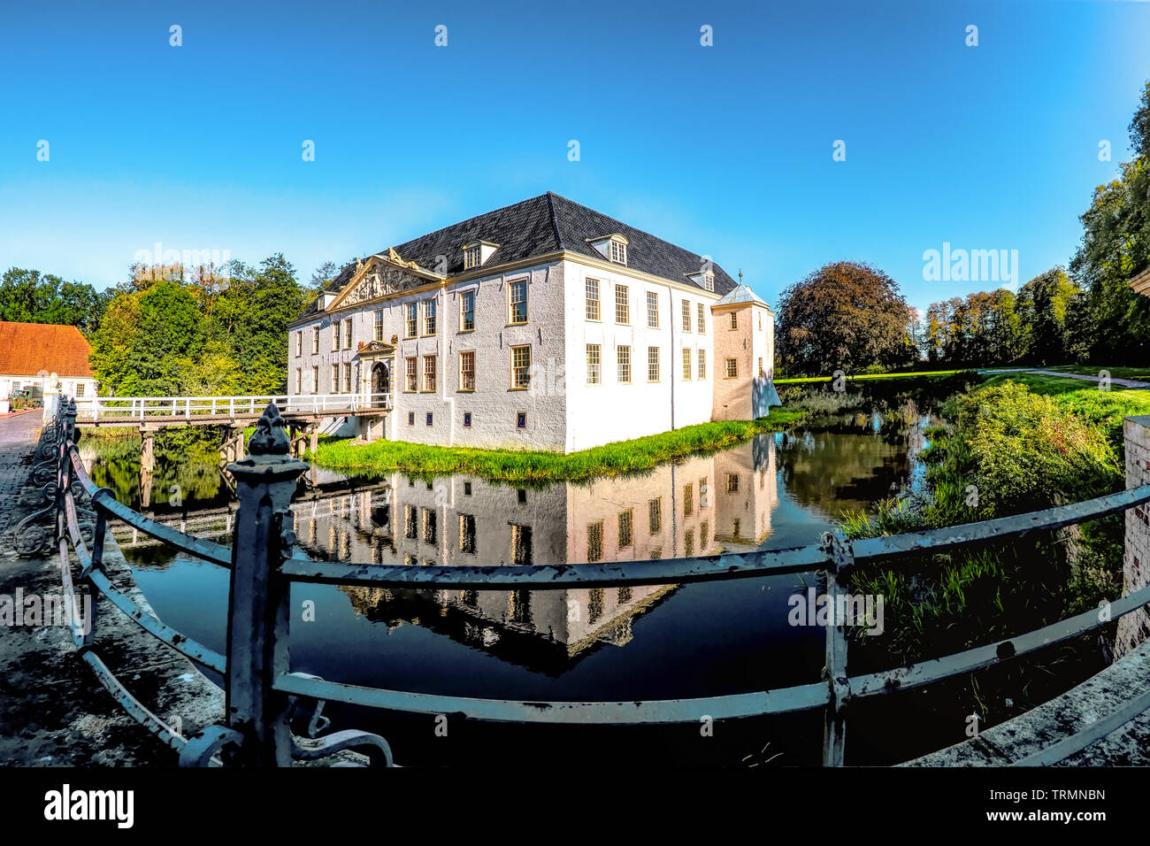 Dornum, Germany, 09/30/2015: The historic Norderburg castle in Dornum in the state of Lower Saxony. The water castle is surrounded by a water ditch. I Stock Photo