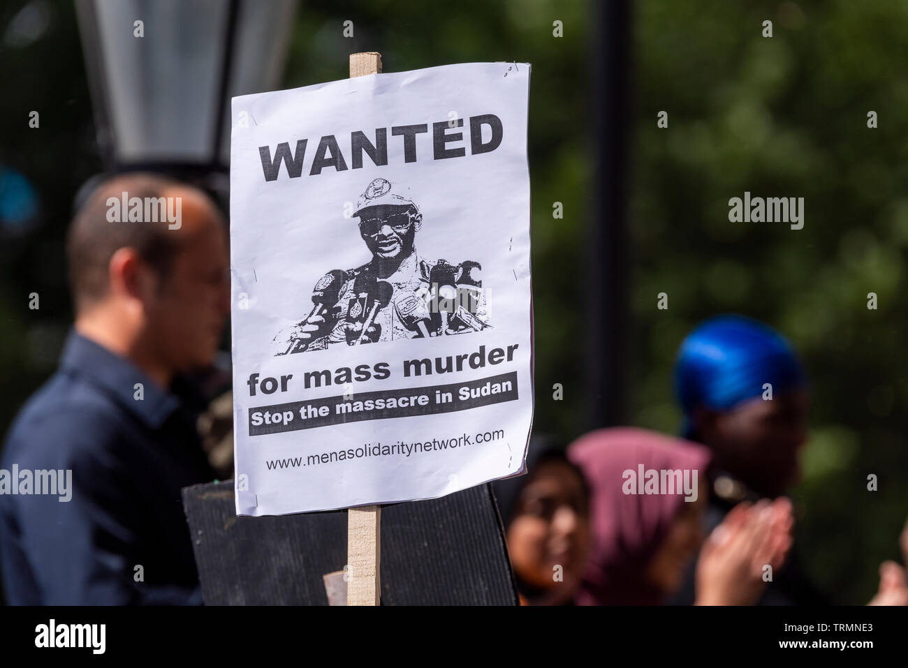 Protest placard. Wanted, for mass murder. Stop the massacre in Sudan. Mena solidarity network. Solidarity with MENA Workers Network. Hemedti image Stock Photo