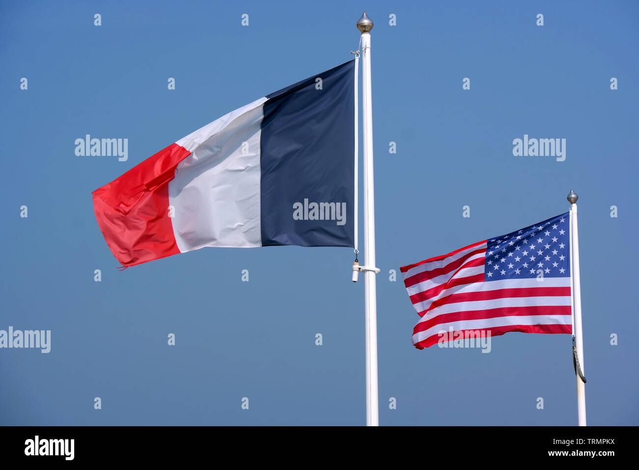 United States of America and France waving flag at a WWII memorial site in Normandy, France Stock Photo