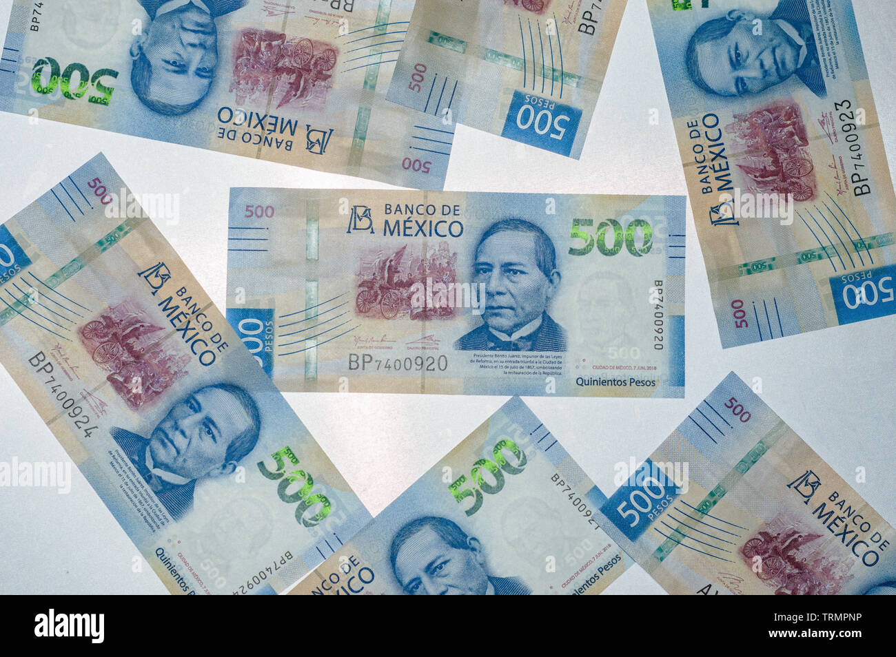 New Mexican 500 peso bills, backlit on grey/blue background. Concept for Mexico, travel, currency,finance, etc with copy space Stock Photo
