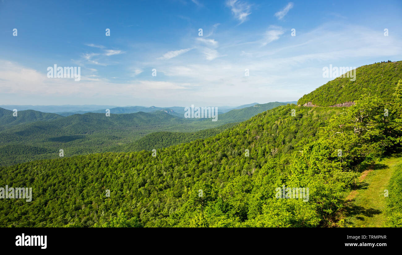 View of the Blue Ridge mountains in North Carolina from an overlook on the Blue Ridge Parkway with Looking Glass Rock in the distance. Stock Photo
