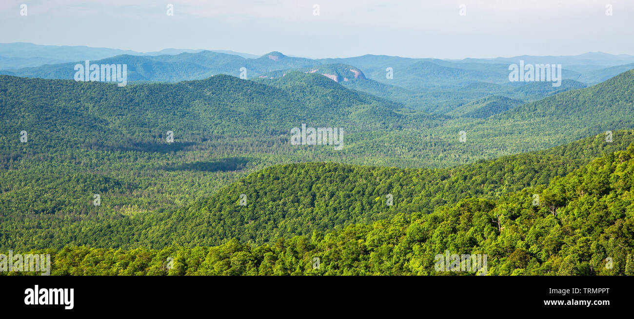 View of the Blue Ridge mountains in North Carolina from an overlook on the Blue Ridge Parkway with Looking Glass Rock in the distance. Stock Photo
