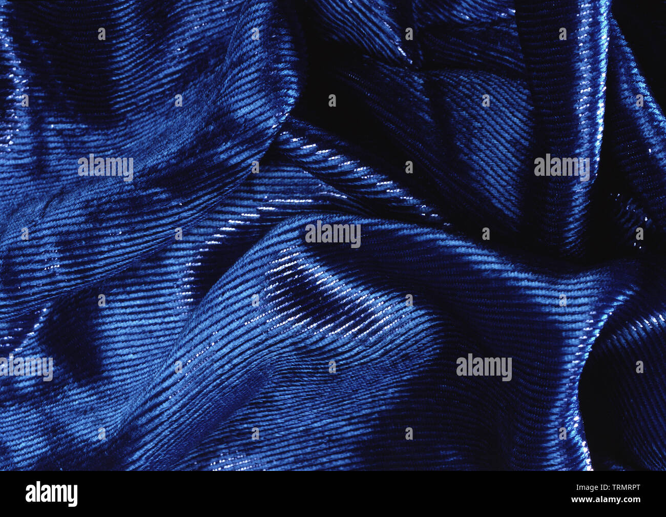 Blue velvet draped velour background. Stock Photo