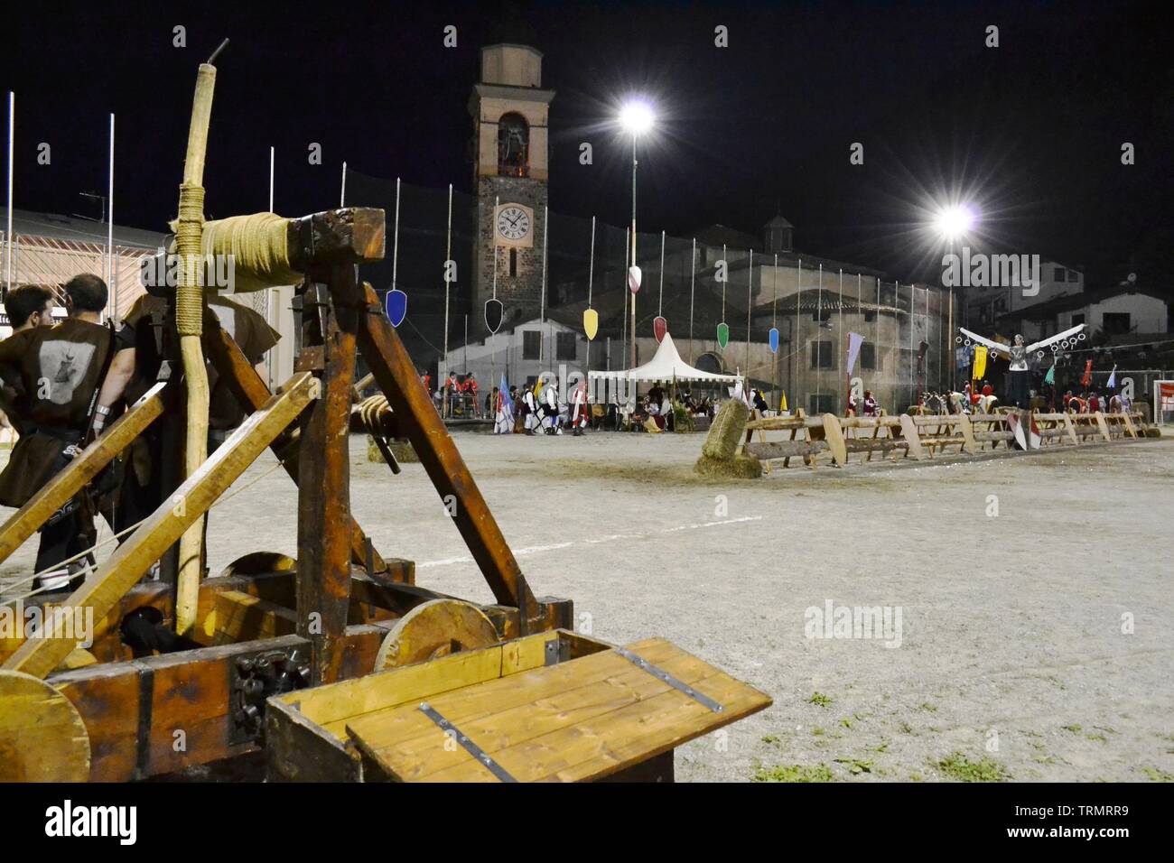 Primaluna/Italy - June 21, 2014: Medieval catapult wooden engine exposed during the traditional village festival of six fractions of the town. Stock Photo
