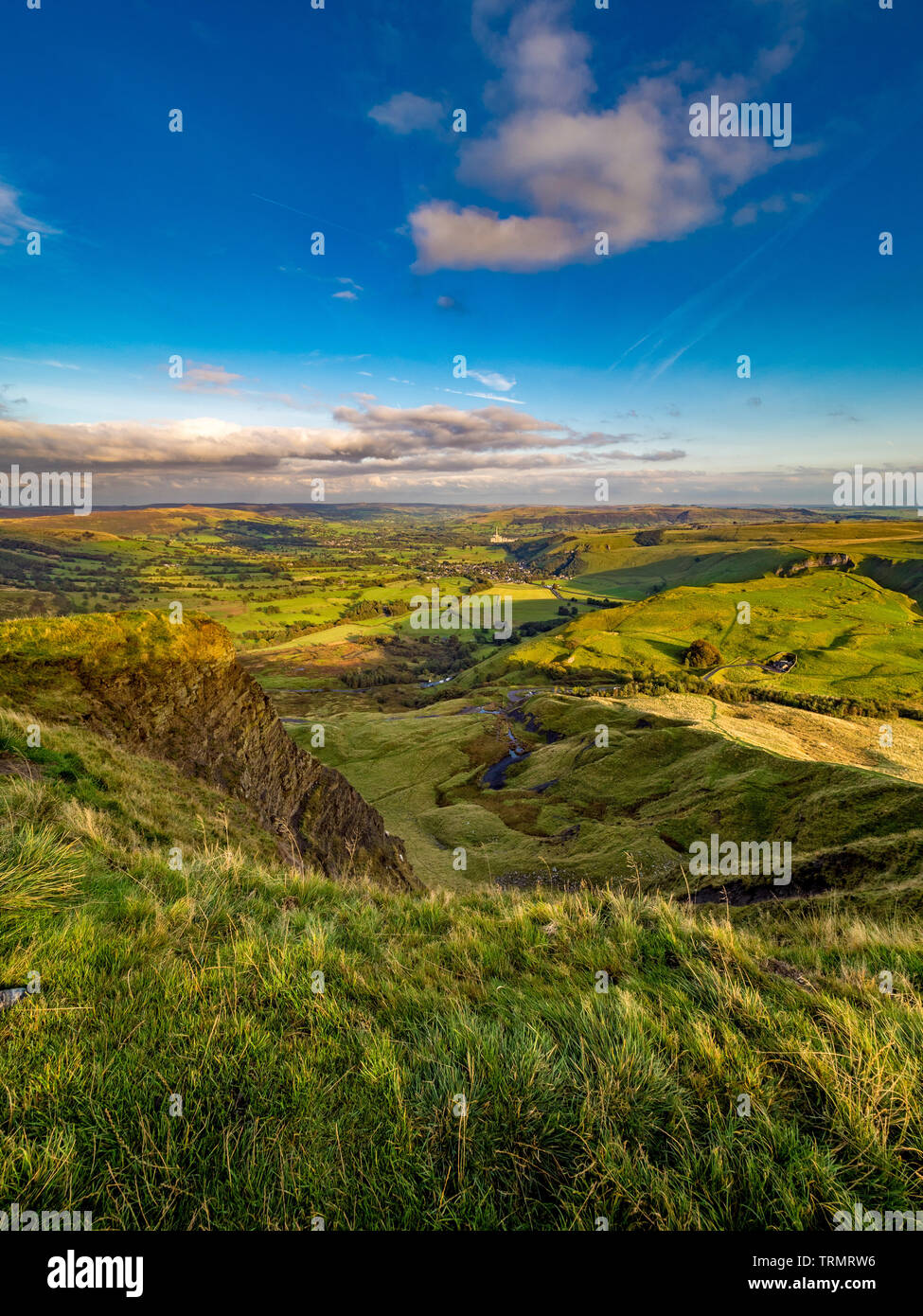 View from summit of Mam Tor down towards Castleton and Hope Valley with Breedon Hope Cement Works in distance, Peak District, UK. Stock Photo