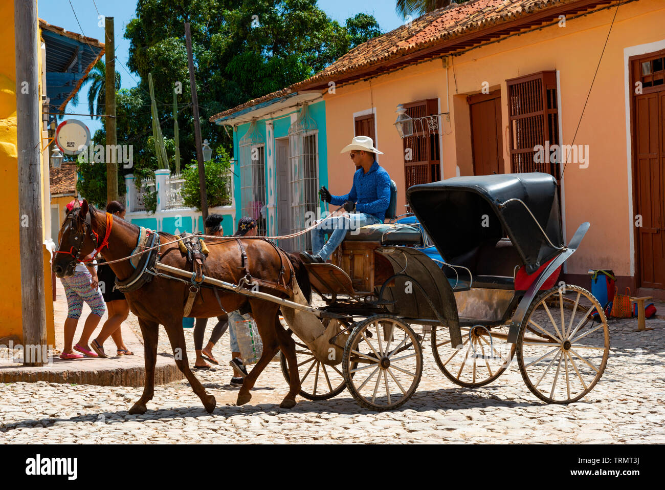 Horse carriage driving  near the main central square of Plaza Mayor, in the UNESCO town of Trinidad, Sancti Spiritus Province, Cuba,Caribbean Stock Photo