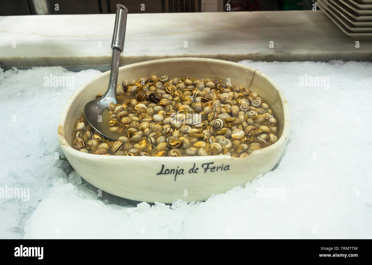 A bowl of fresh periwinkles in the Feria Market in Seville Stock Photo