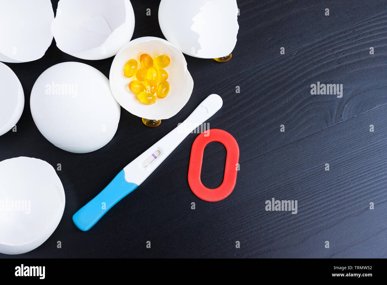 Infertility. Negative pregnancy test, pills, eggshell and number zero