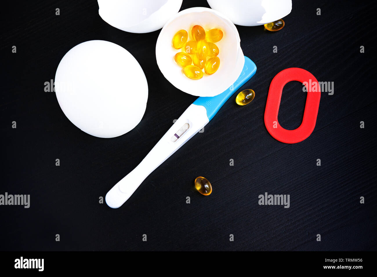 Infertility. Negative pregnancy test, pills, eggshell and number zero