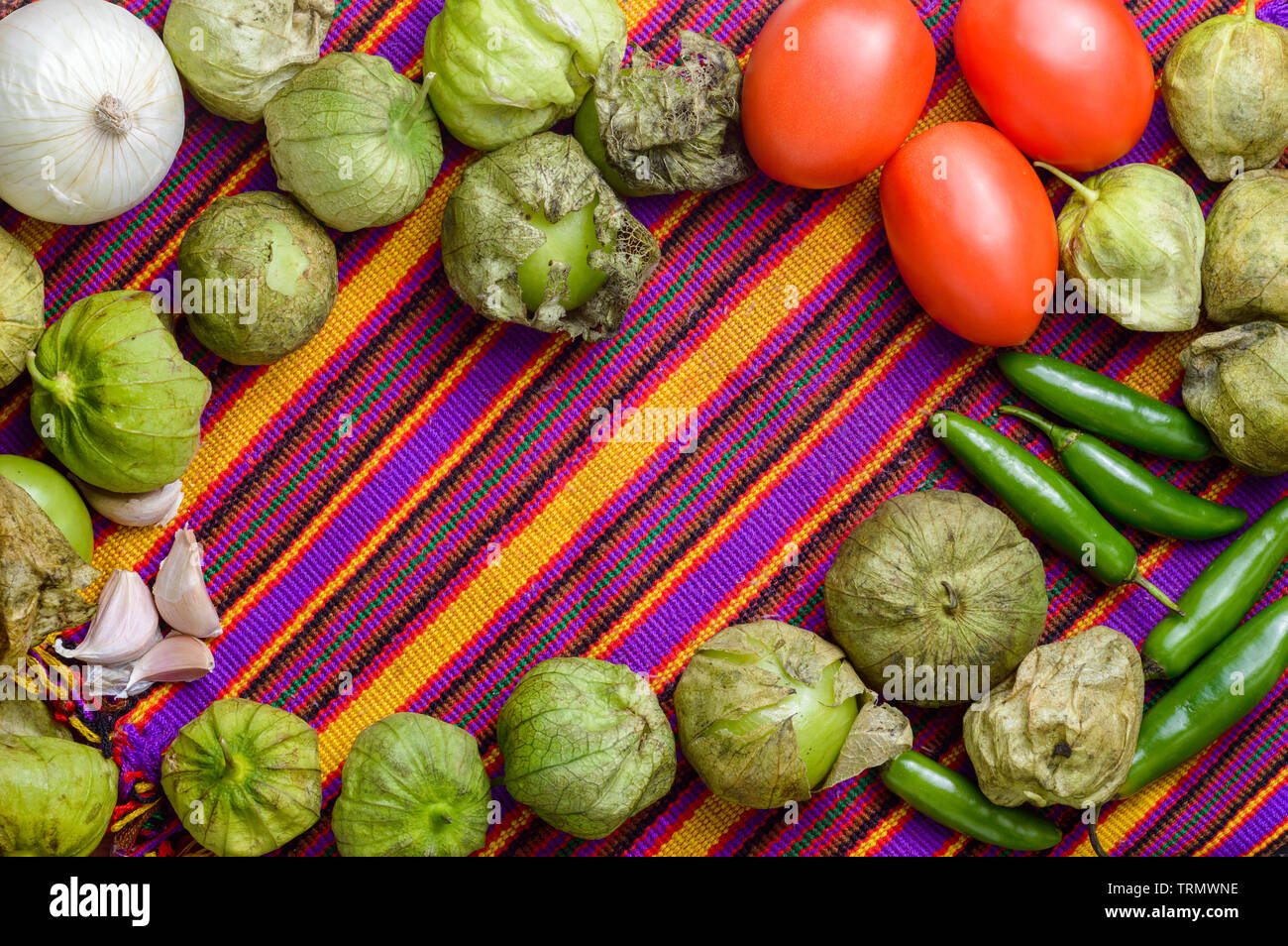 Ingredients for cooking Mexican green sauce, known as salsa verde, top