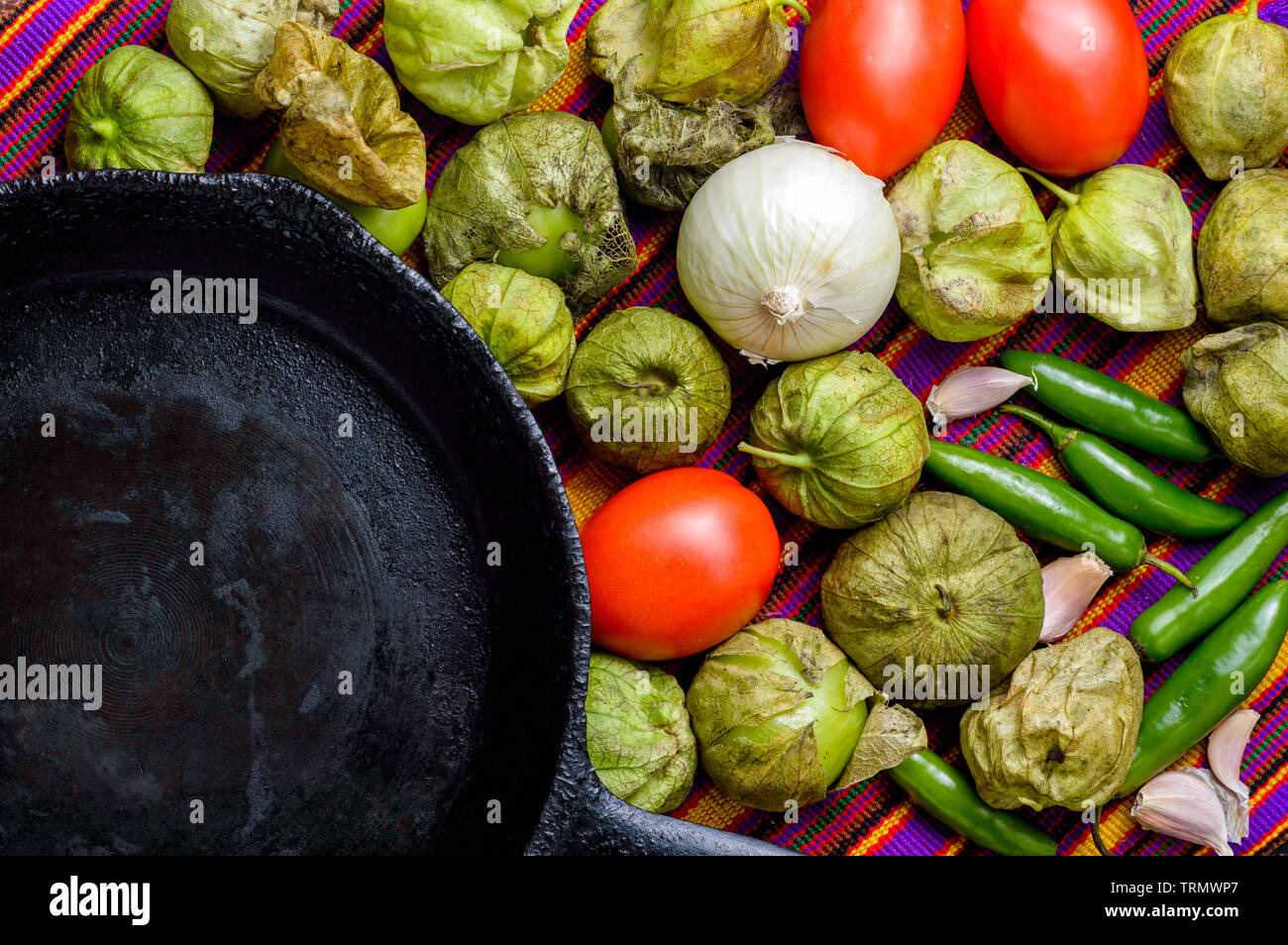 Ingredients for cooking Mexican green sauce, known as salsa verde, top