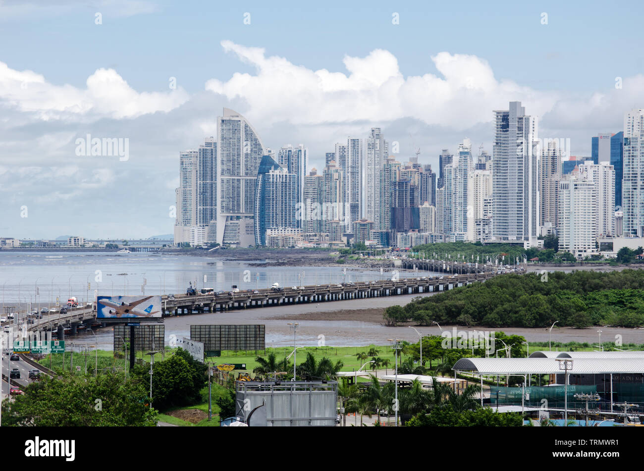 Panama City skyline as seen from Costa del Este neighborhood. The South Corridor that connects the city centre with tocumen airport is also seen. Stock Photo