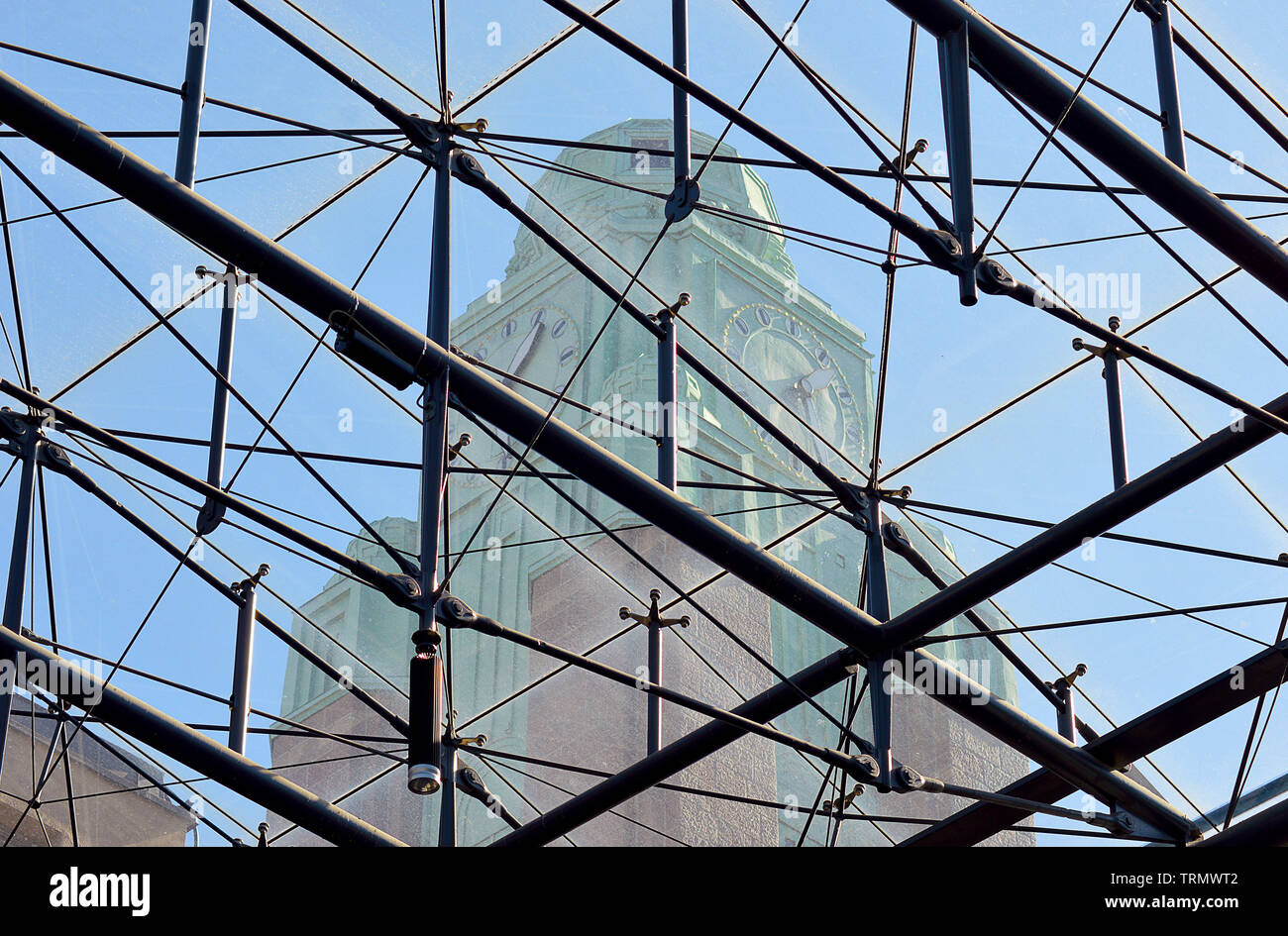 HELSINKI, FINLAND - 6 APRIL 2019: The copper-domed clock tower of Eliel Saarinen's Central Station seen through its glass roof. Stock Photo