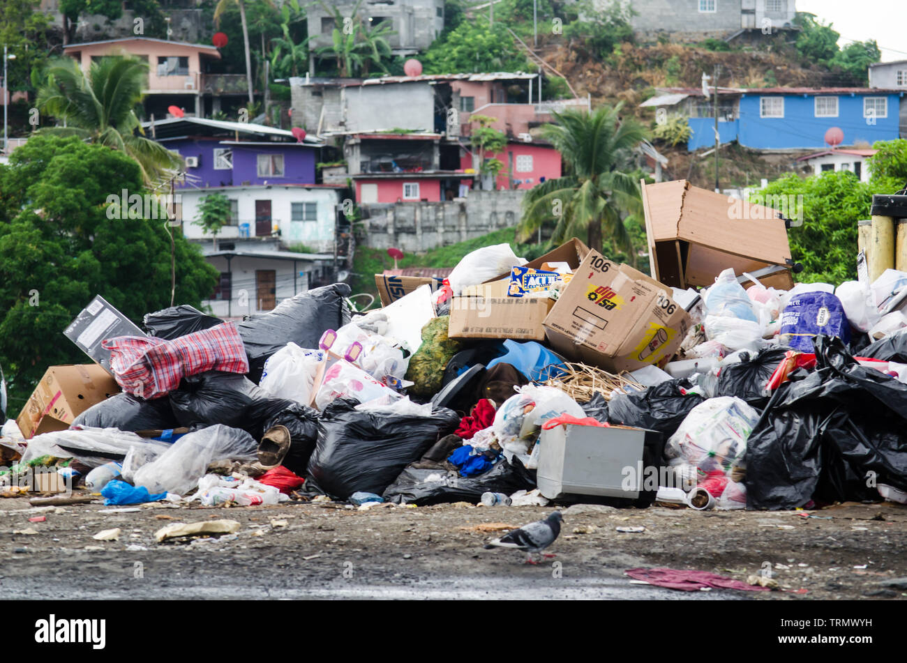 Hills of accumulated trash evidence the problems in the waste disposal system in Panama City outskirts. Stock Photo