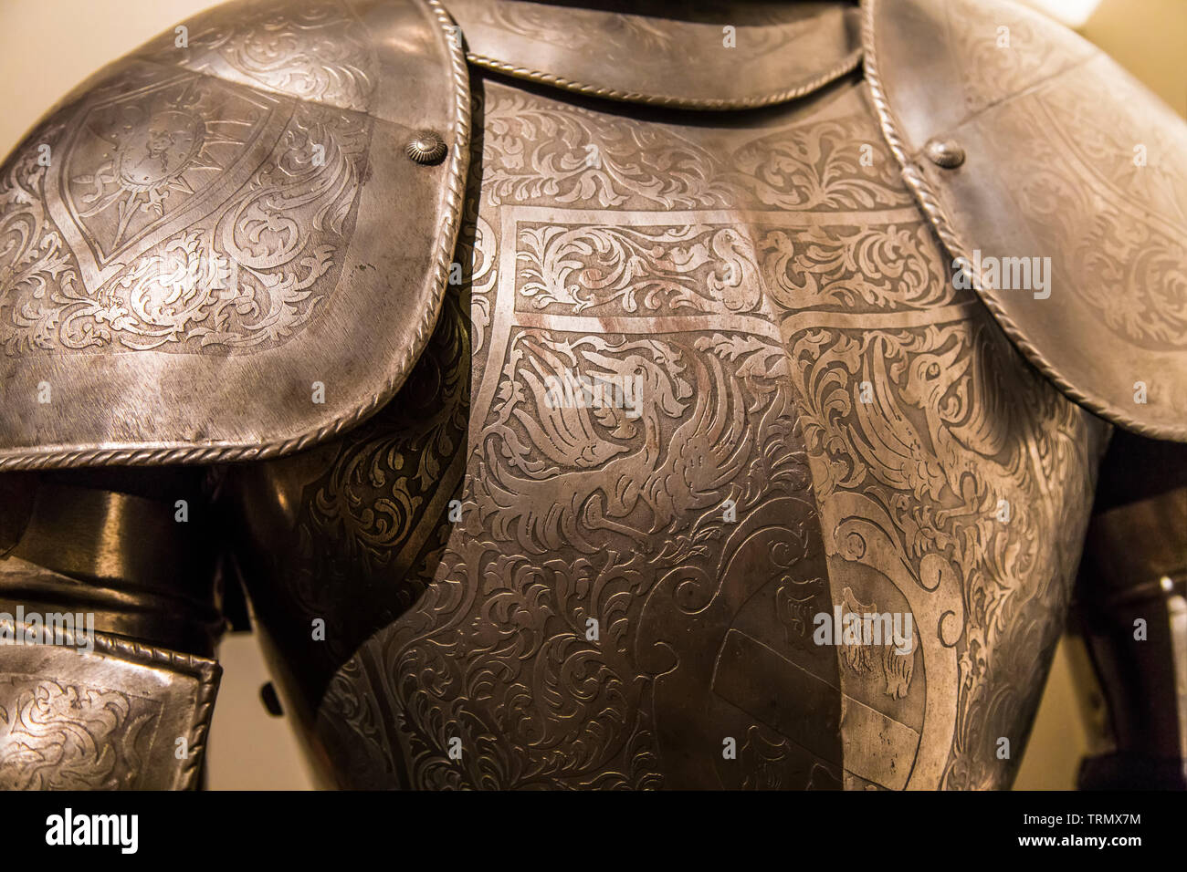 Fragment of ancient armor, decorated with etched pattern Stock Photo