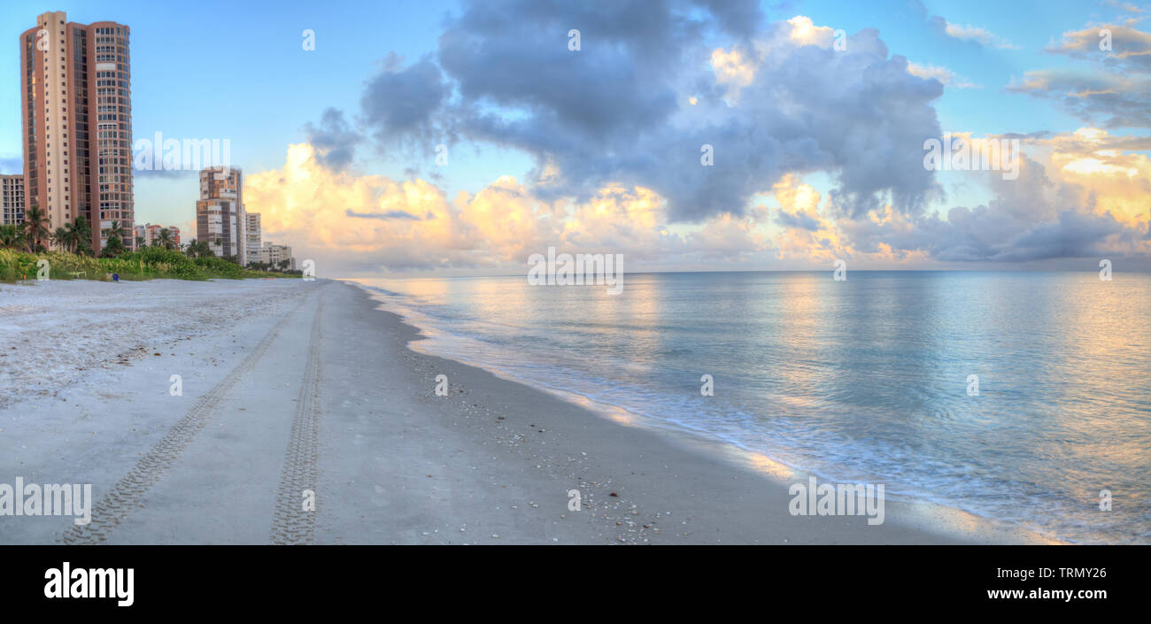 High rise buildings in the distance on North Naples Beach at sunrise in ...