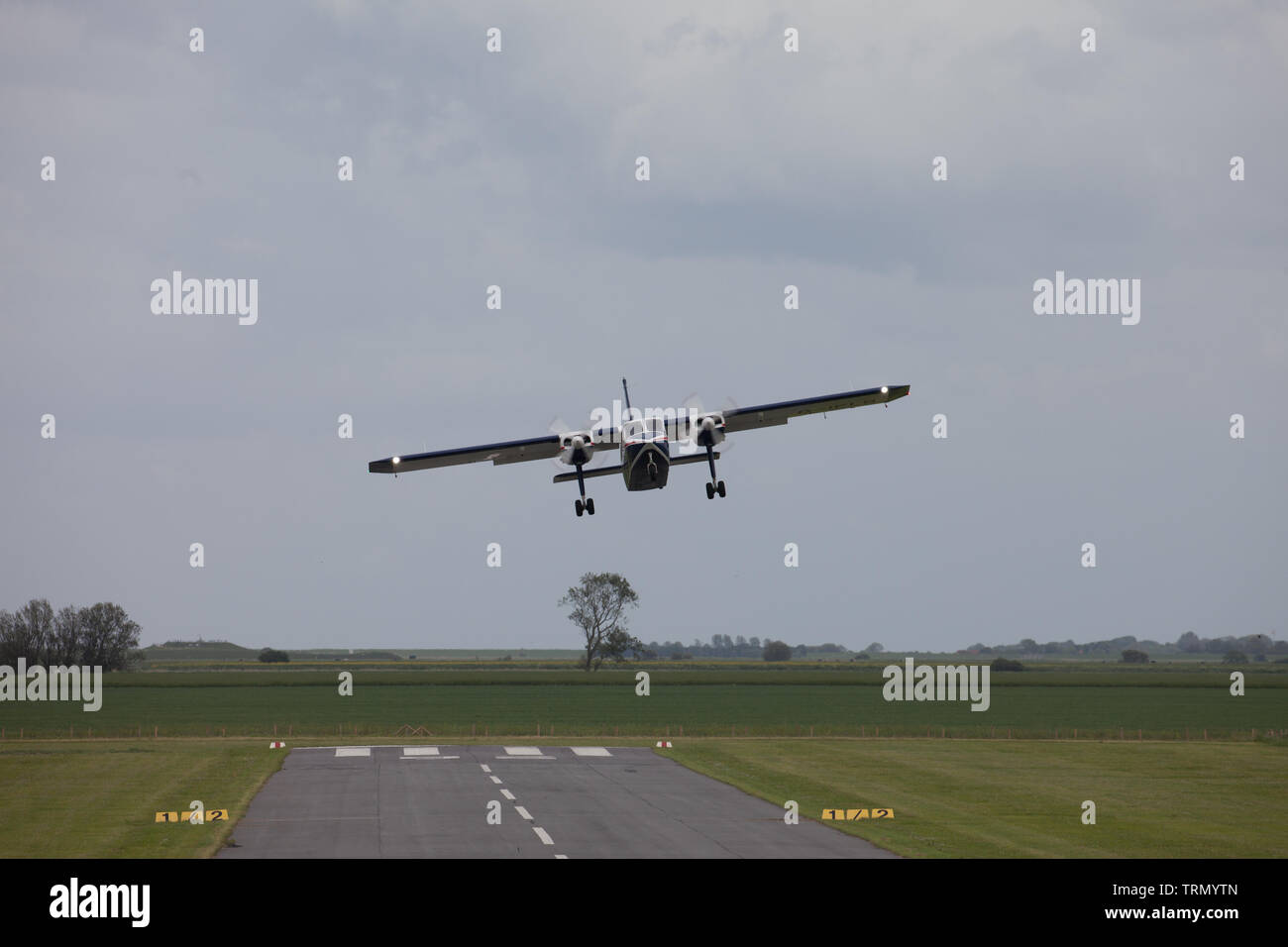 Twin engined aircraft taking off for East Frisian Islands. Germany. Stock Photo