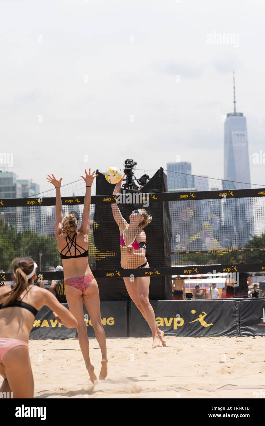 Sara Hughes/Summer Ross  competing against Taylor Nyquist/Tory Paranagua with One World Trade  Center in the background during the 2019 New York City Stock Photo