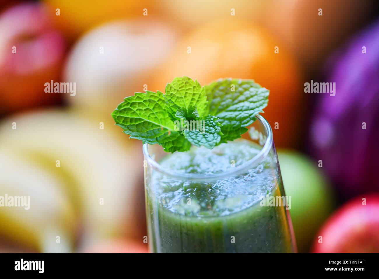 peppermint tea / green mint leaf on fresh vegetable juice smoothie and