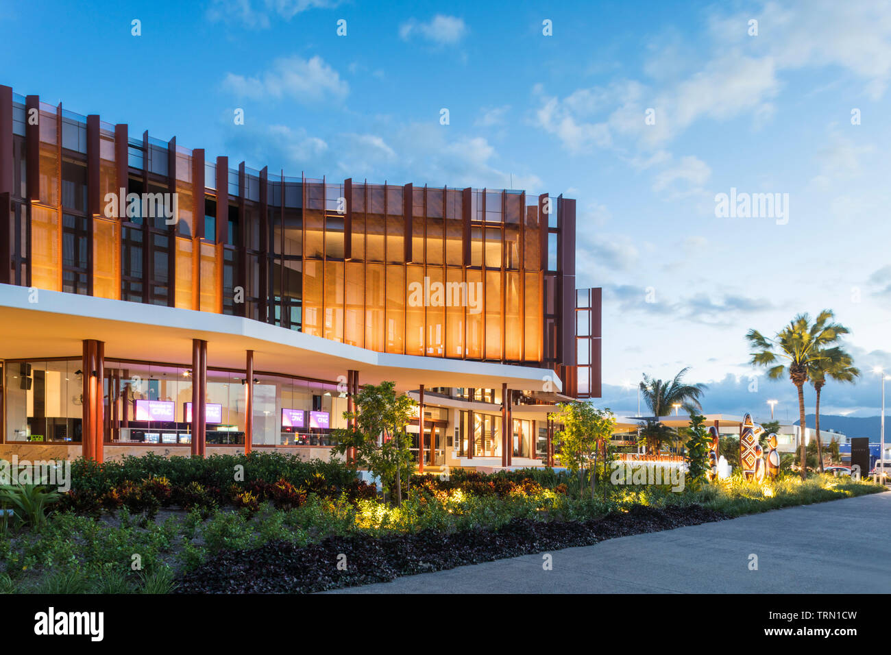 The facade of the Cairns Performing Arts Centre illuminated at twilight, Cairns, Queensland, Australia Stock Photo