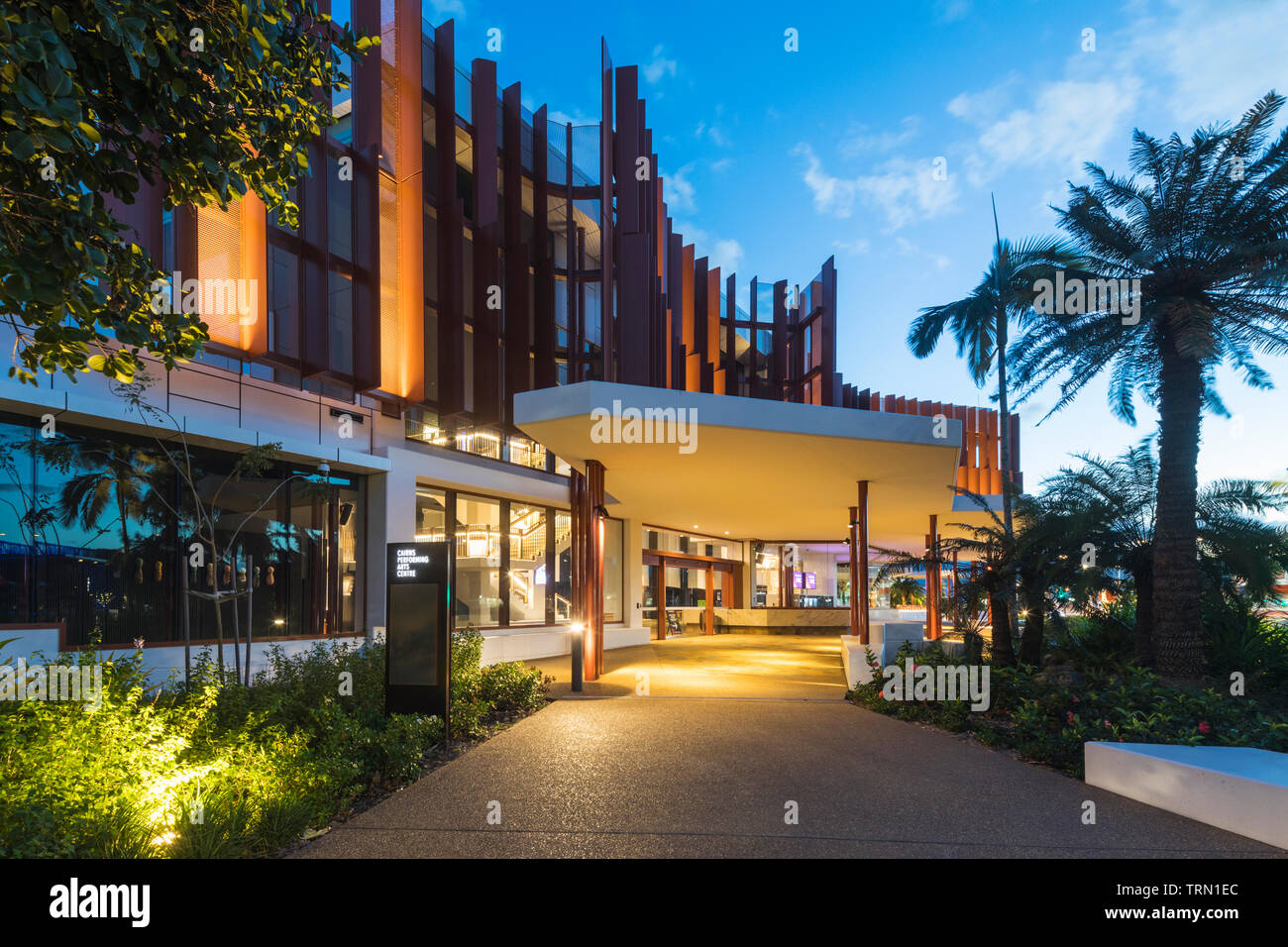 Entry to the Cairns Performing Arts Centre illuminated at twilight, Cairns, Queensland, Australia Stock Photo