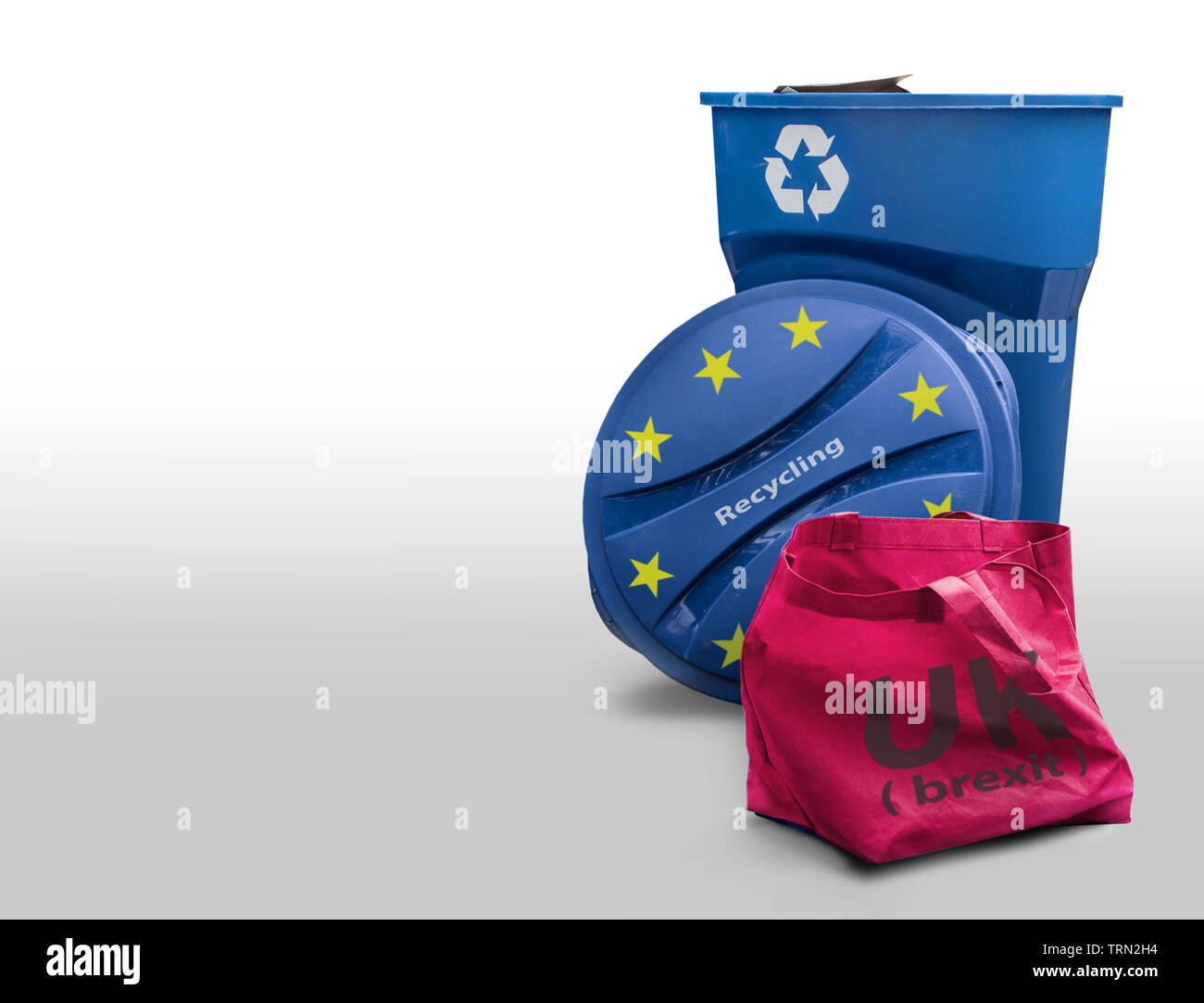 Close to the recycling bin we see a bag that represents the Brexit.. Stock Photo