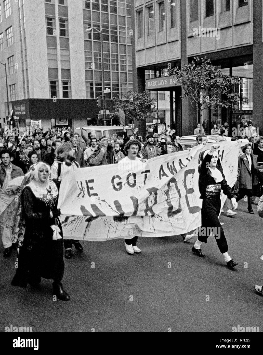 protesters of the Dan White sentence in the assassination of Mayor George Moscone and gay supervisor, Harvey Milk, march and carry 'He got away with murder' banner, in San Francisco, 1970s Stock Photo