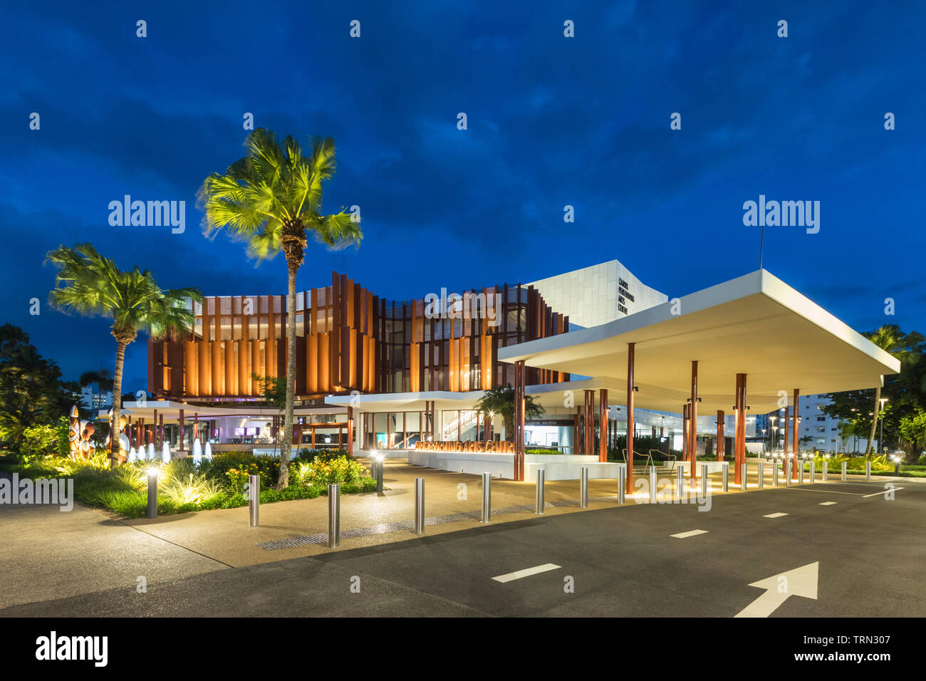 Entrance to the Cairns Performing Arts Centre illuminated at twilight, Cairns, Queensland, Australia Stock Photo