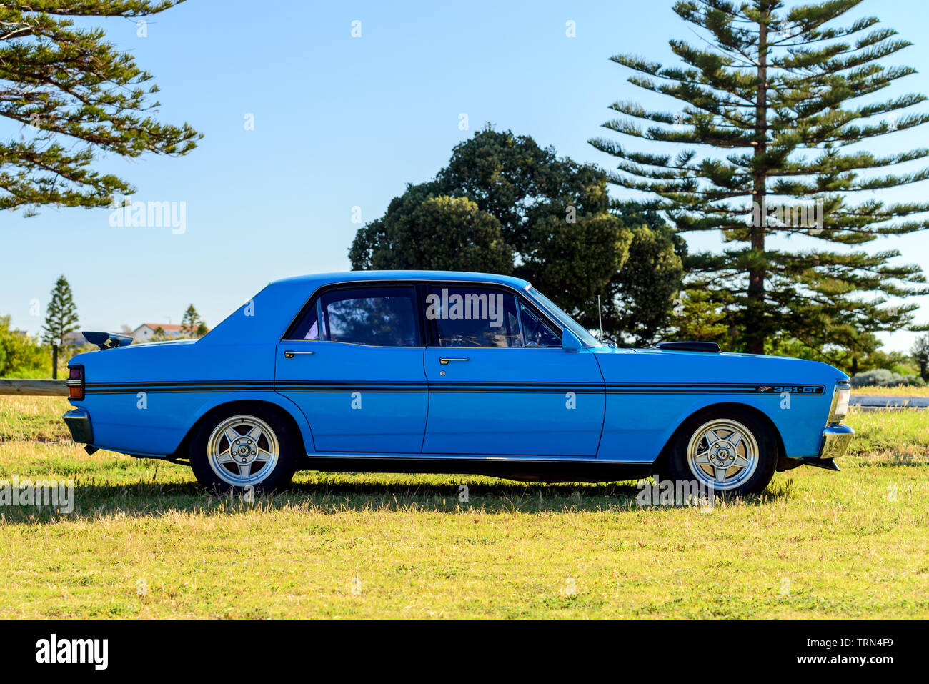 Port Adelaide, South Australia - October 14, 2017: Side view of iconic Australian made Ford Falcon 351-GT parked on the grass on a day Stock Photo