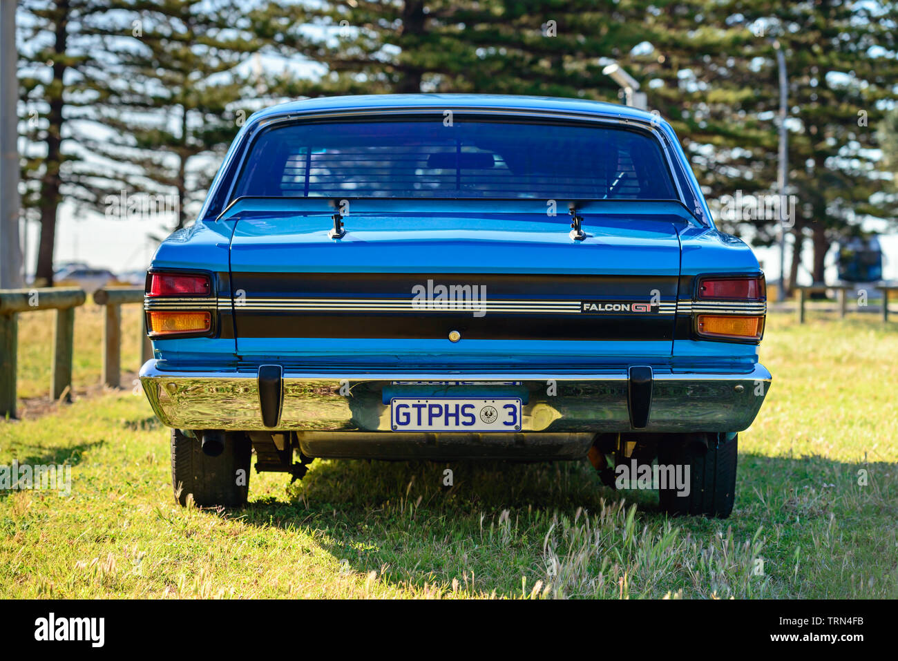 Port Adelaide, South Australia - October 14, 2017: Rear view of iconic Australian made Ford Falcon 351-GT parked on the grass on a day Stock Photo