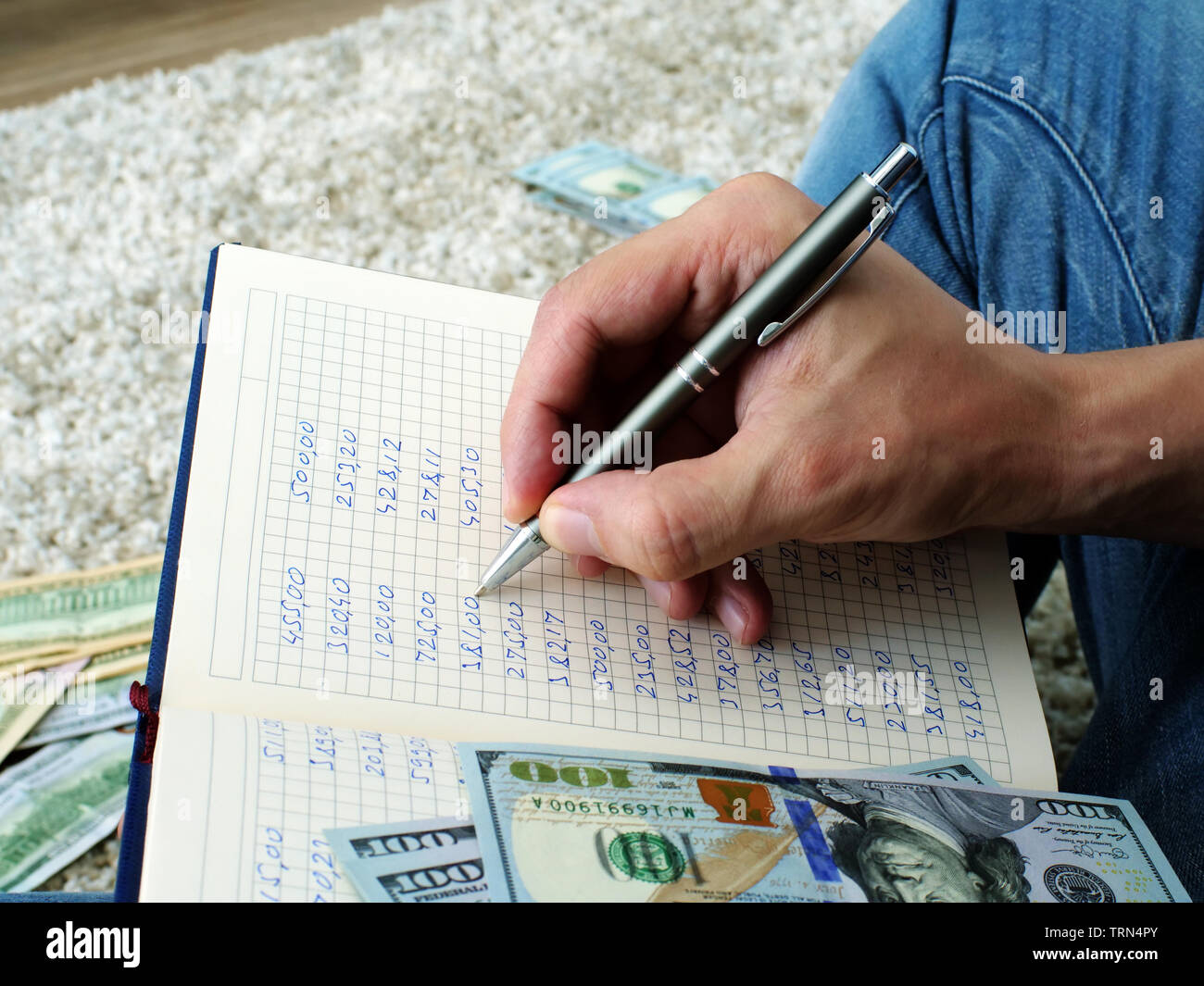 Man is calculating monthly home budget and expenses. Stock Photo
