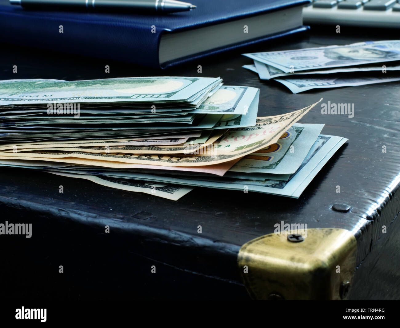 Personal savings concept. Stack of money on an old table Stock Photo ...