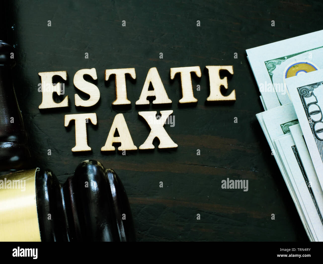 Estate tax from wooden letters and gavel. Stock Photo