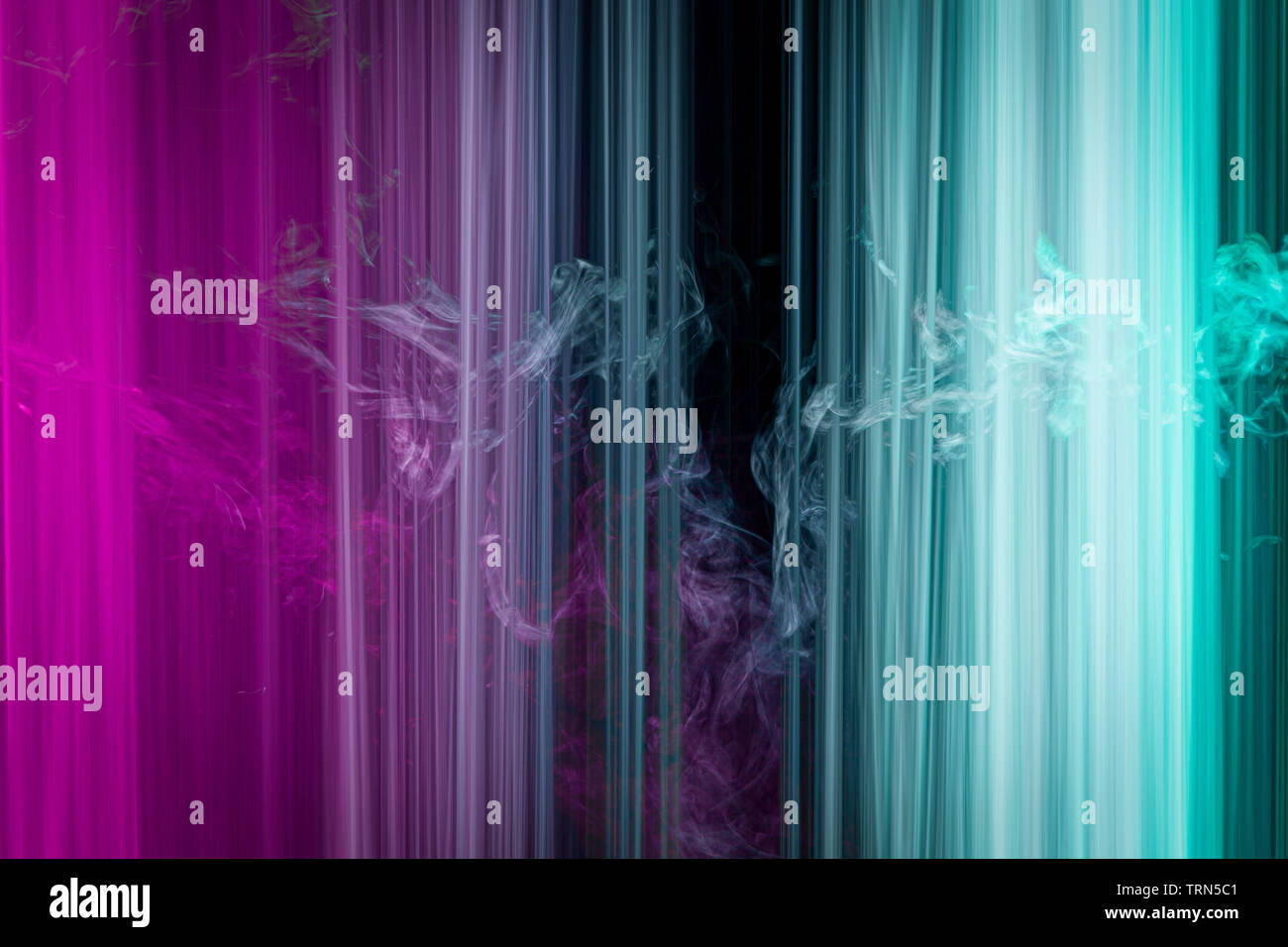 Abstract blue and pink neon glowing crossing lines pattern. Dark ...