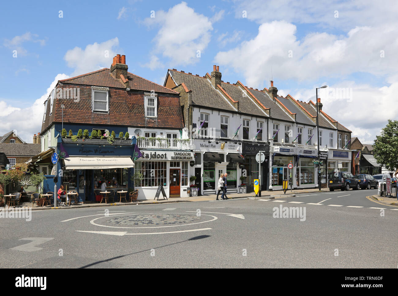 Wimbledon Village, a wealthy area of southwest London, near the famous tennis club. Shows restaurants on the junction of High Street and Church Road Stock Photo