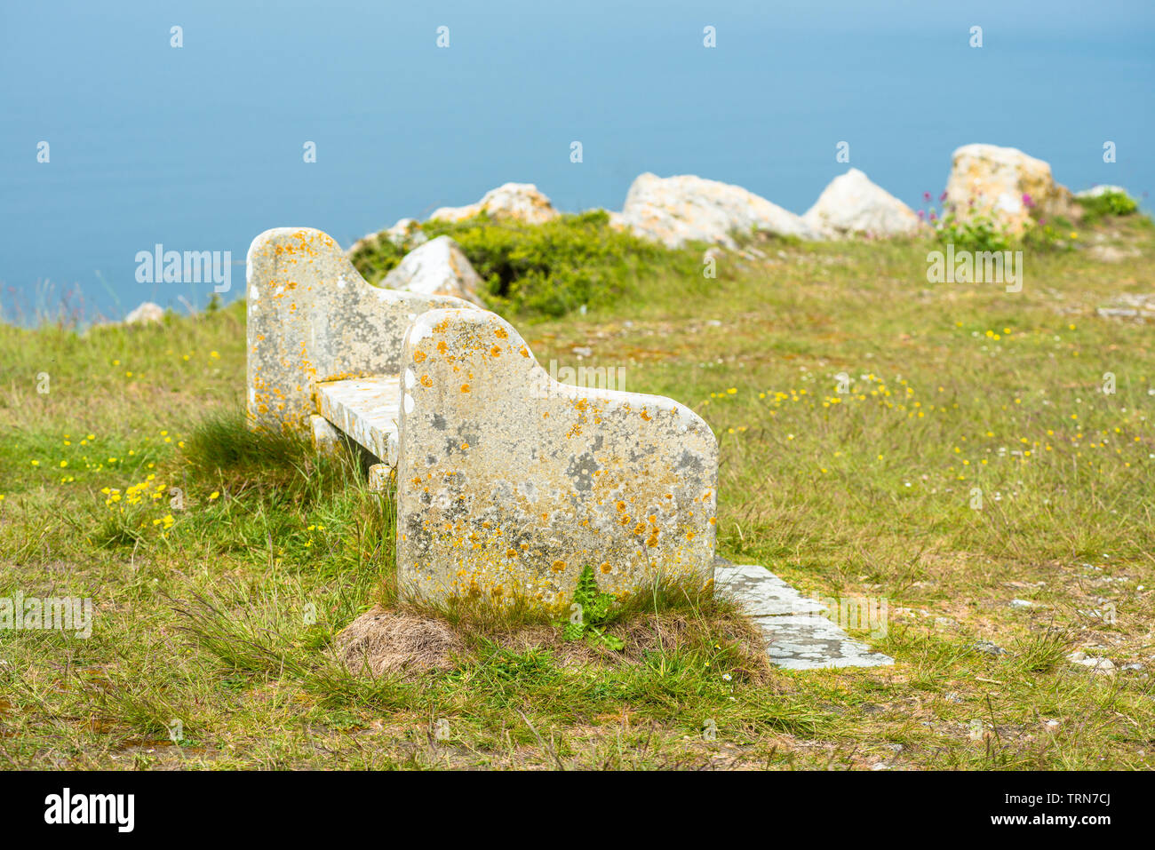 A bench on Portland Heights, made from Portland stone sourced locally from nearby quarry. Isle of Portland, Doreset, England, UK. Stock Photo