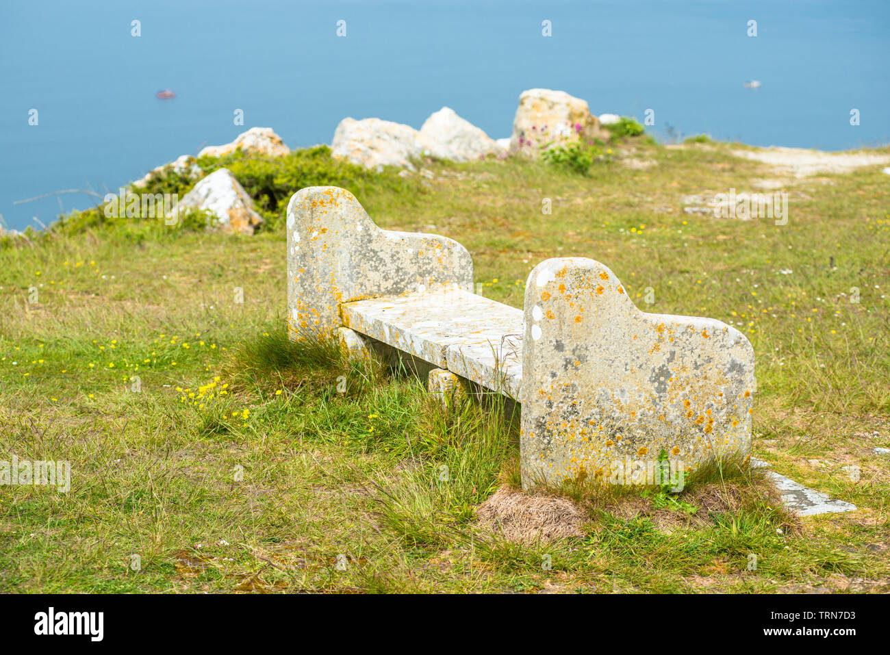 A bench on Portland Heights, made from Portland stone sourced locally from nearby quarry. Isle of Portland, Doreset, England, UK. Stock Photo