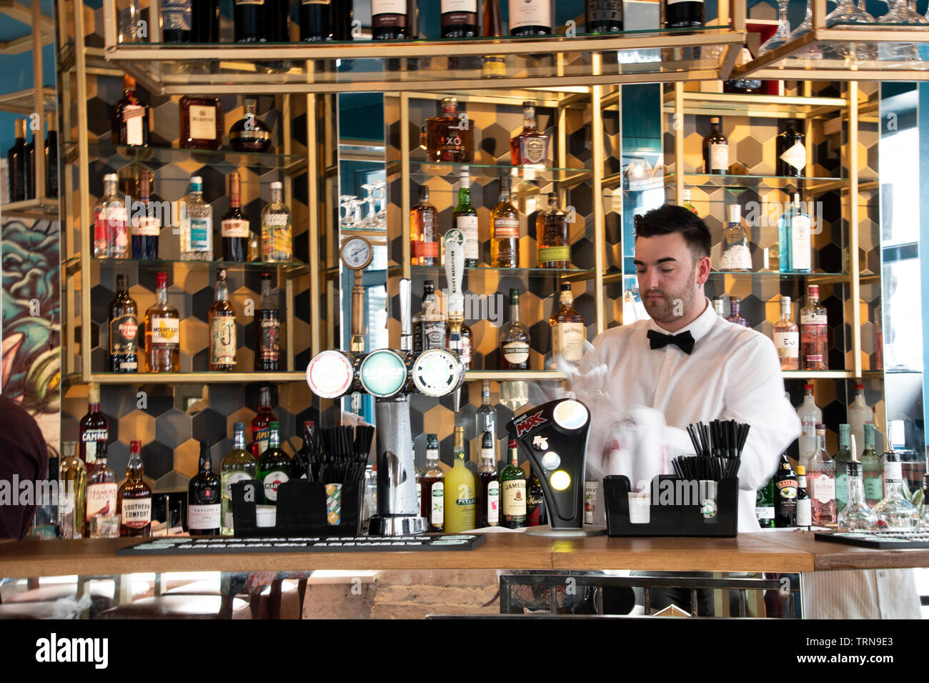 Doncaster, UK May 11 2019 Barman polishing glasses at La Boca restaurant & steakhouse, 1