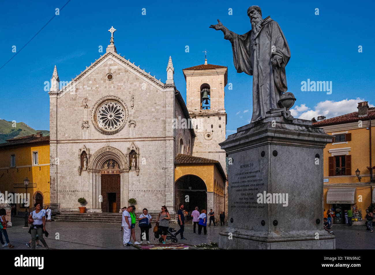 Italy Umbria Norcia - Piazza San Benedetto - statue of Saint benedict and cathedral Stock Photo
