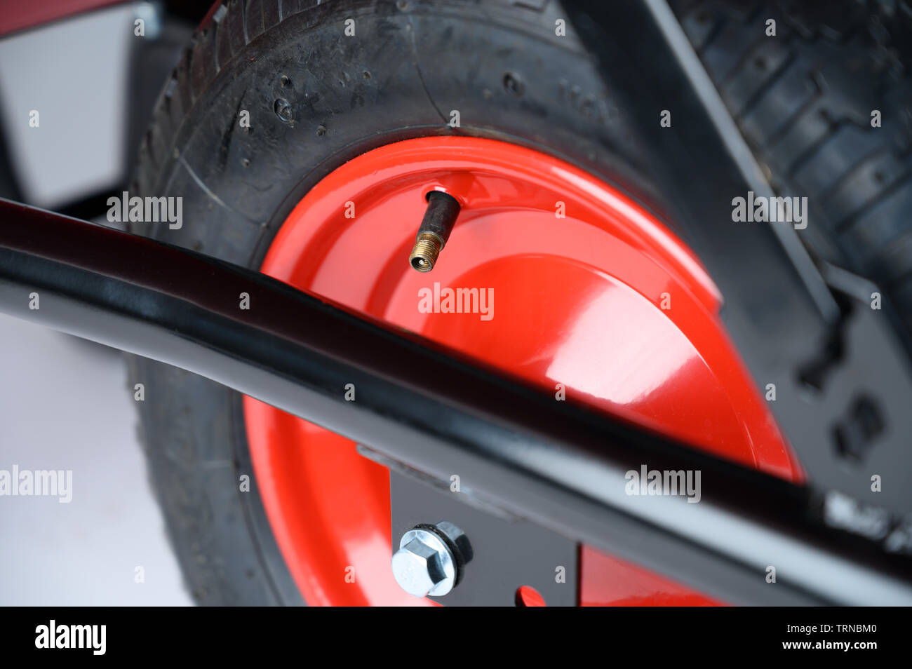 Wheelbarrow wheel valve and tyre Stock Photo