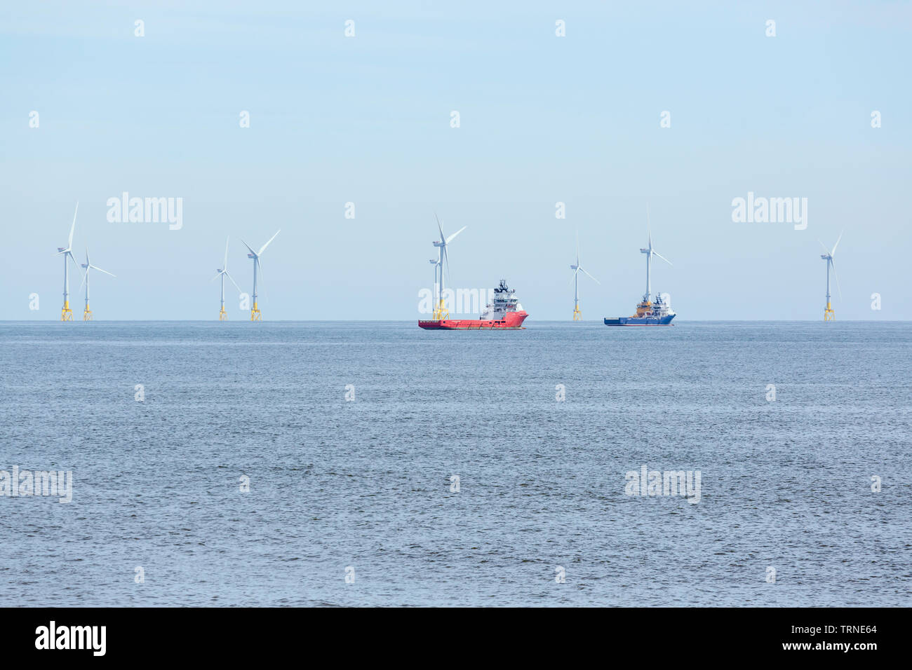 Aberdeen Bay offshore windfarm beside ships, Aberdeenshire, Scotland, UK Stock Photo