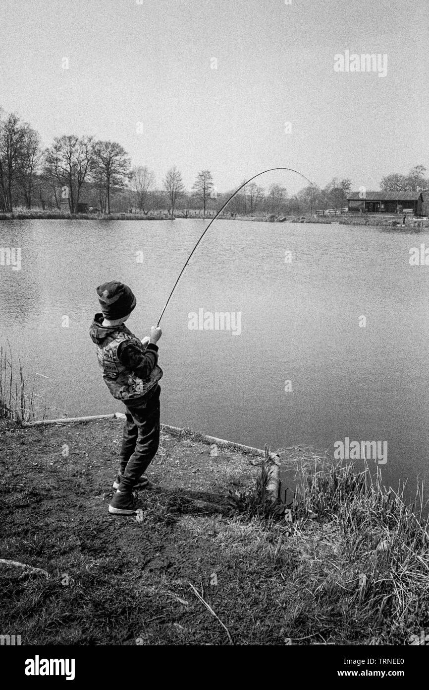 https://c8.alamy.com/comp/TRNEE0/ten-year-old-boy-fishing-at-dever-springs-trout-fishery-winchester-hampshire-england-united-kingdom-TRNEE0.jpg