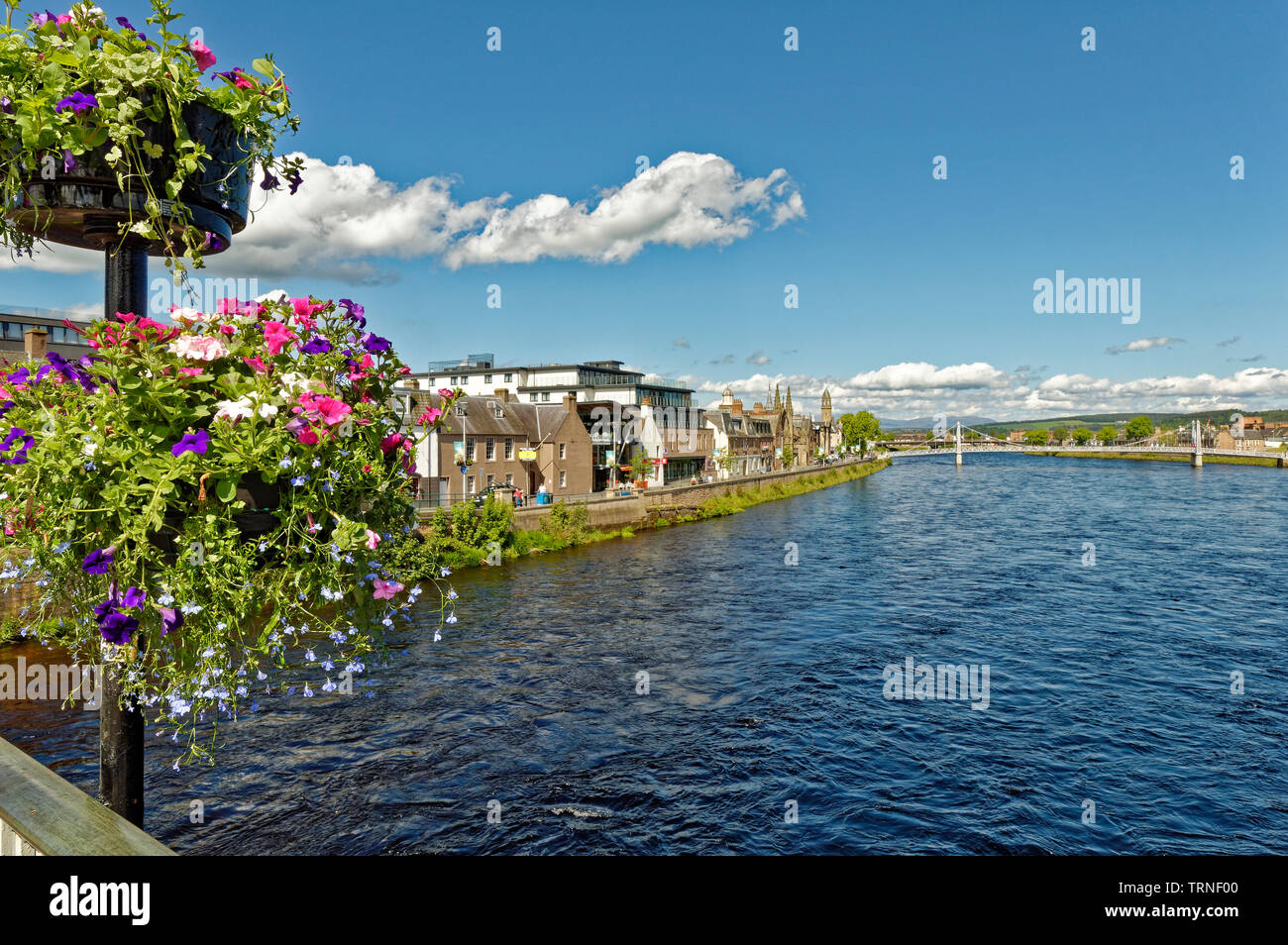 INVERNESS CITY SCOTLAND VIEW OVER RIVER NESS FROM NESS ROAD BRIDGE WITH FLOWERS TO HUNTLY STREET