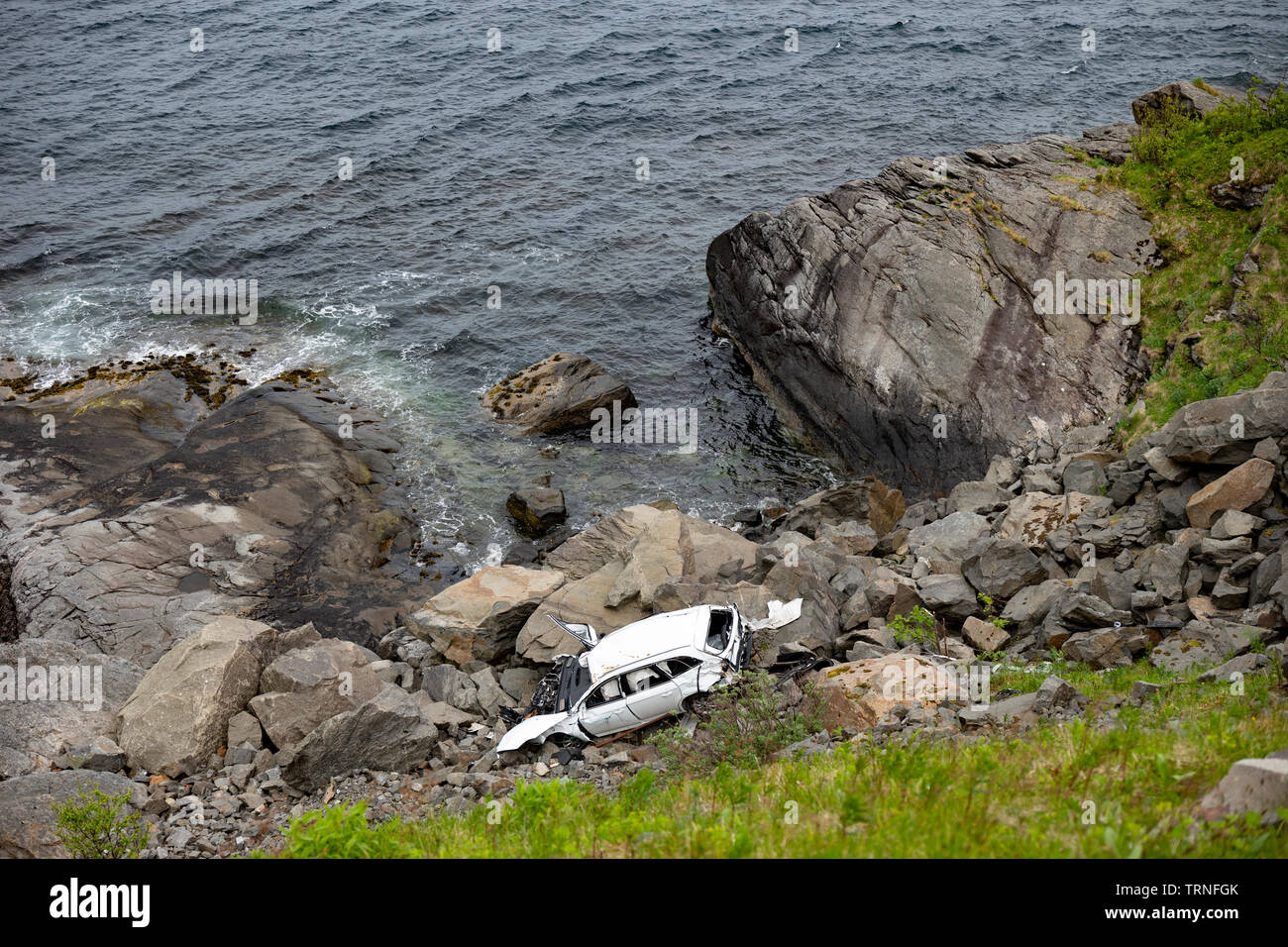 Result of tourists driving off a cliff between Moskenes and Reine, Lofoten Islands, Norway, summer 2019. Stock Photo