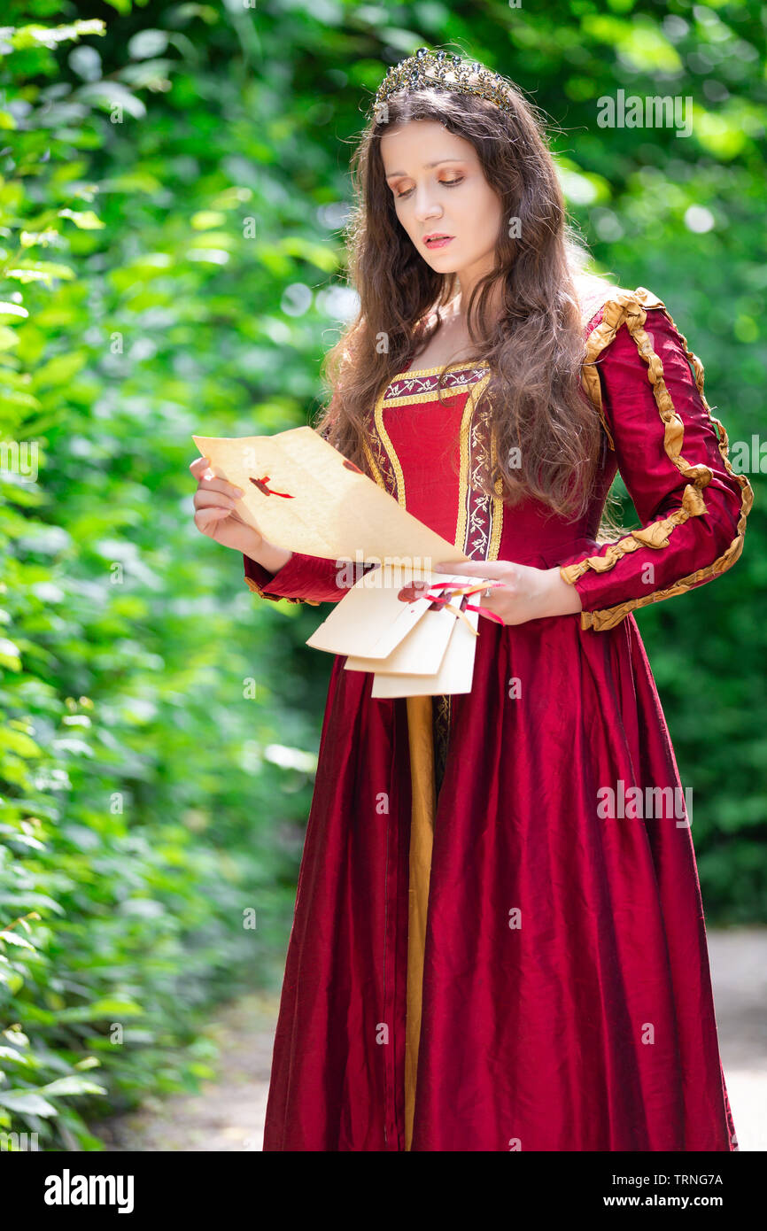 Portrait of brunette woman dressed in historical Baroque clothes